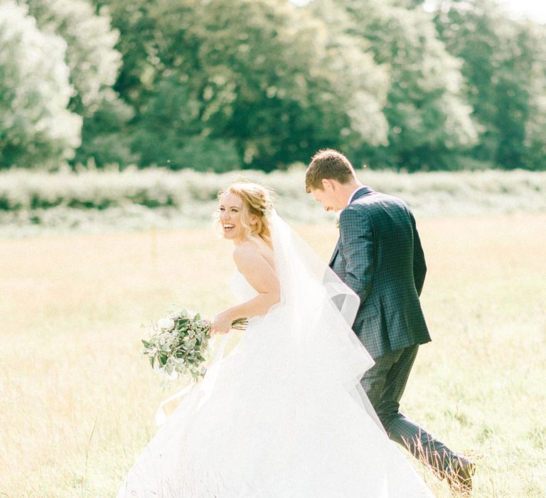 Bride in Strapless Sassi Holford Ballgown Wedding Dress with Belt | Groom in Blue Check Paul Smith Suit | Loose Bouquet of White Flowers and Foliage | Hazel Gap Barn Wedding with Bride Arriving by Kit Car | Sarah-Jane Ethan Photography