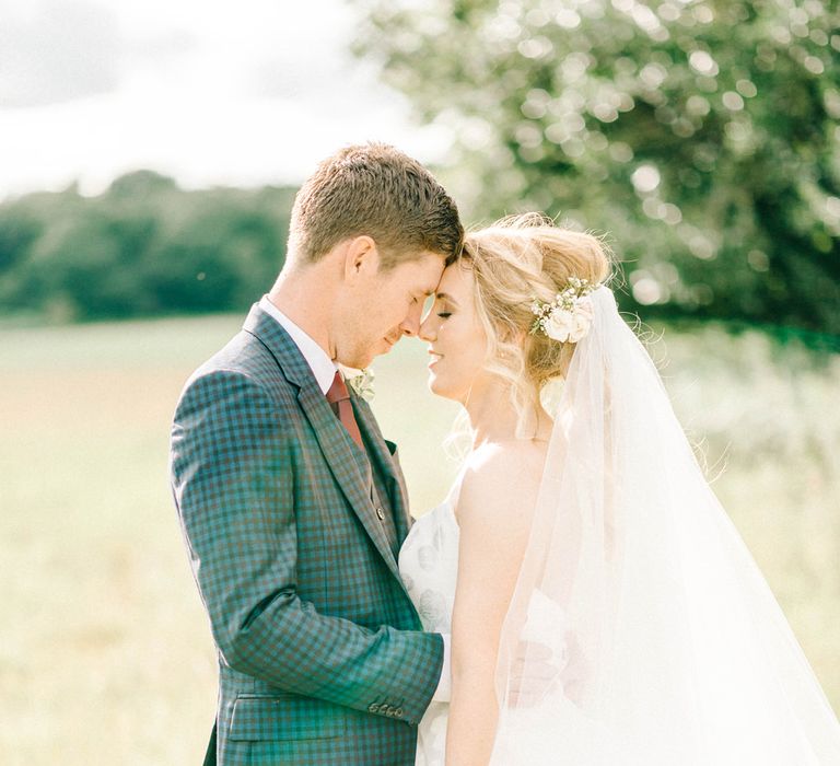 Bride in Strapless Sassi Holford Ballgown Wedding Dress with Belt | Groom in Blue Check Paul Smith Suit | Loose Bouquet of White Flowers and Foliage | Hazel Gap Barn Wedding with Bride Arriving by Kit Car | Sarah-Jane Ethan Photography