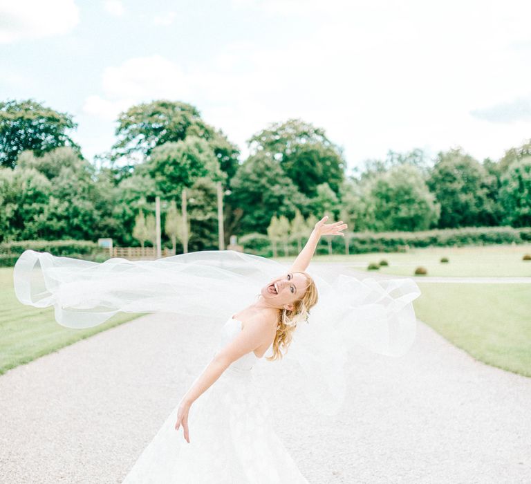 Bride in Strapless Sassi Holford Ballgown Wedding Dress with Belt | Hazel Gap Barn Wedding with Bride Arriving by Kit Car | Sarah-Jane Ethan Photography