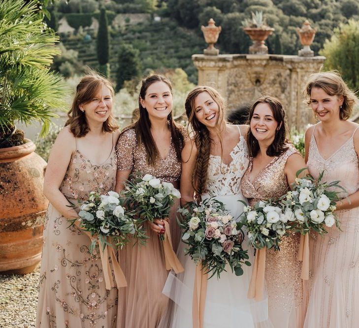 Bridal Party With Bridesmaids in Pink and Rose Gold Dresses