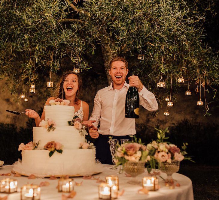 Bride and Groom Cutting the Cake