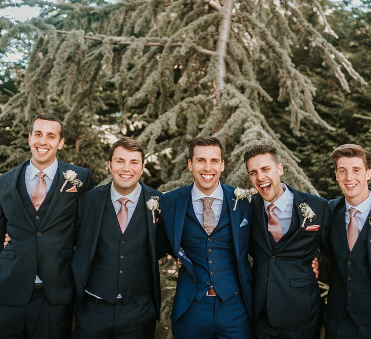 Groomsmen Portrait with Men in Navy Moss Bros. Suits