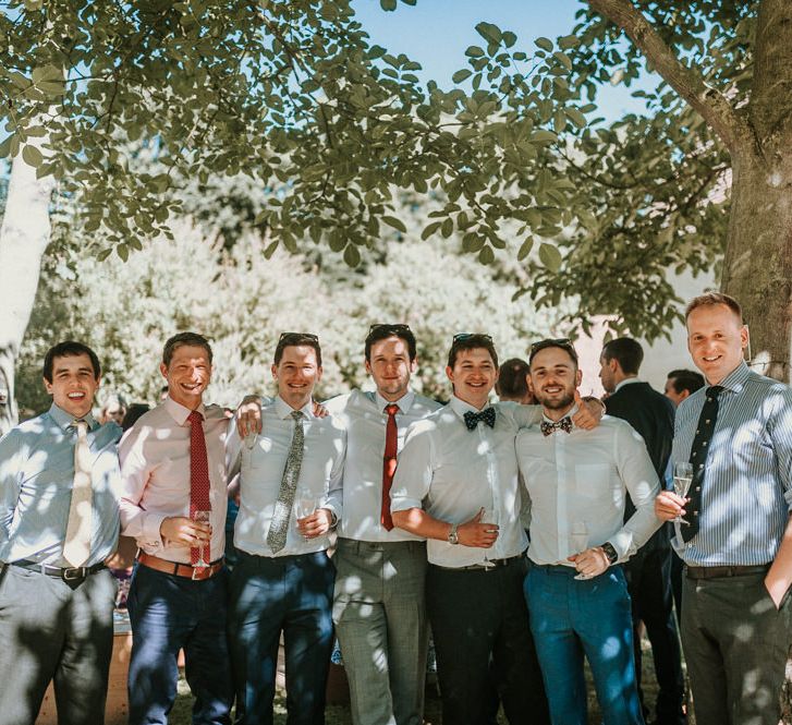 Groomsmen Enjoying a Beer in the Garden