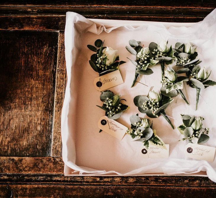 Green and White Buttonholes