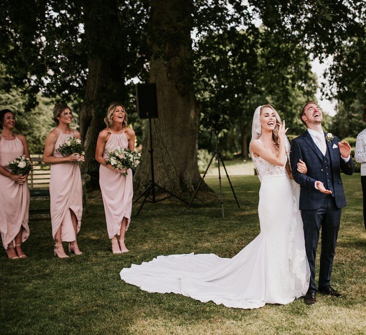 Bride and Groom Laughing During Outdoor Wedding Ceremony