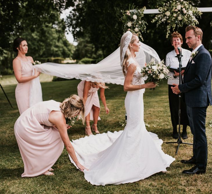 Wedding Ceremony with Bride in Pronovias Wedding Dress and Groom in Moss Bros. Suit