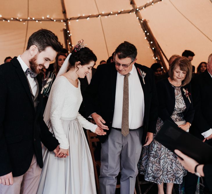 Tipi Wedding Ceremony with Bride in Silver Skirt and Groom in Pink Chinos