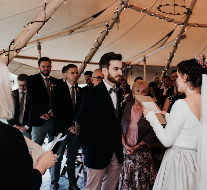 Bride Reading Her Vows to Her Groom During the Tipi Wedding Reception