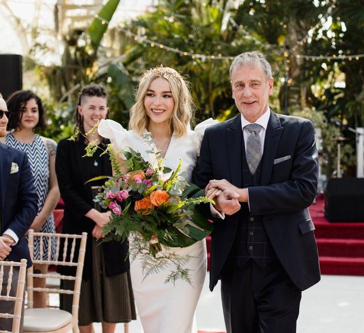 Bride walks down the aisle