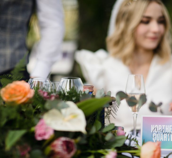 Bright wedding flowers and table name cards