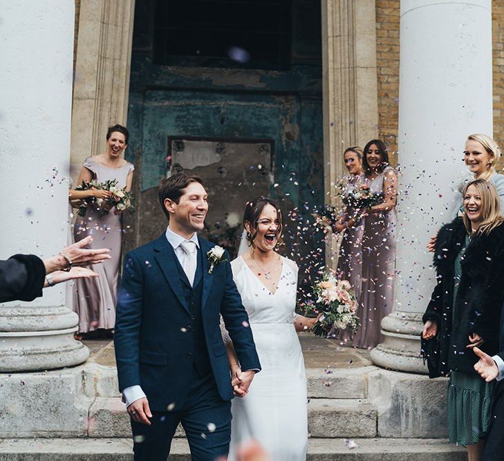 Bride and Groom Confetti Exit Bridesmaids in Dusky Pink Bridesmaid Dresses