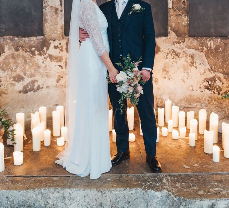 Bride and Groom with Candle Backdrop