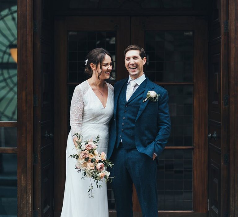 Bride and Groom in Navy Three Piece Suit