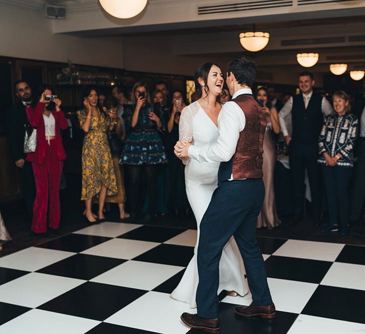 Bride and Groom First Dance with Dusky Pink Bridesmaid Dresses