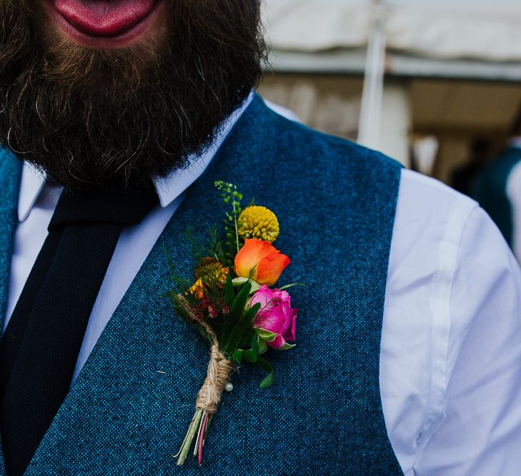 Colourful Flower Buttonhole | Brightly Coloured Festival Wedding with Outdoor Humanist Ceremony &amp; Tipi Reception on the Yorkshire Dales | Tim Dunk Photography