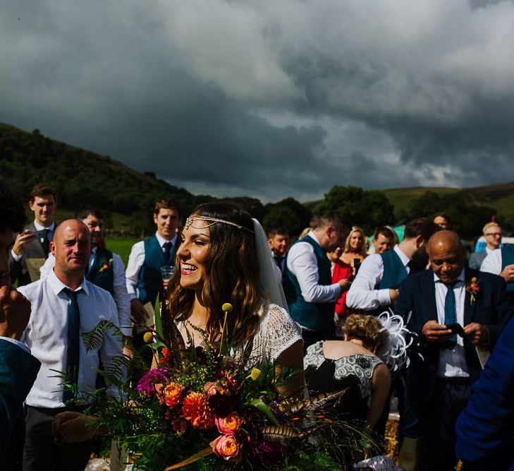 Wedding Ceremony |  Bridal Entrance  in Daughters of Simone Lace Gown | Brightly Coloured Festival Wedding with Outdoor Humanist Ceremony &amp; Tipi Reception on the Yorkshire Dales | Tim Dunk Photography