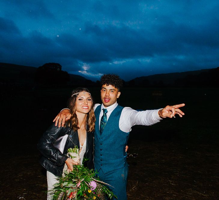 Evening Reception | Bride in Daughters of Simone Lace Gown | Groom in Tweed Suit | Brightly Coloured Festival Wedding with Outdoor Humanist Ceremony &amp; Tipi Reception on the Yorkshire Dales | Tim Dunk Photography | Brightly Coloured Festival Wedding with Outdoor Humanist Ceremony &amp; Tipi Reception on the Yorkshire Dales | Tim Dunk Photography