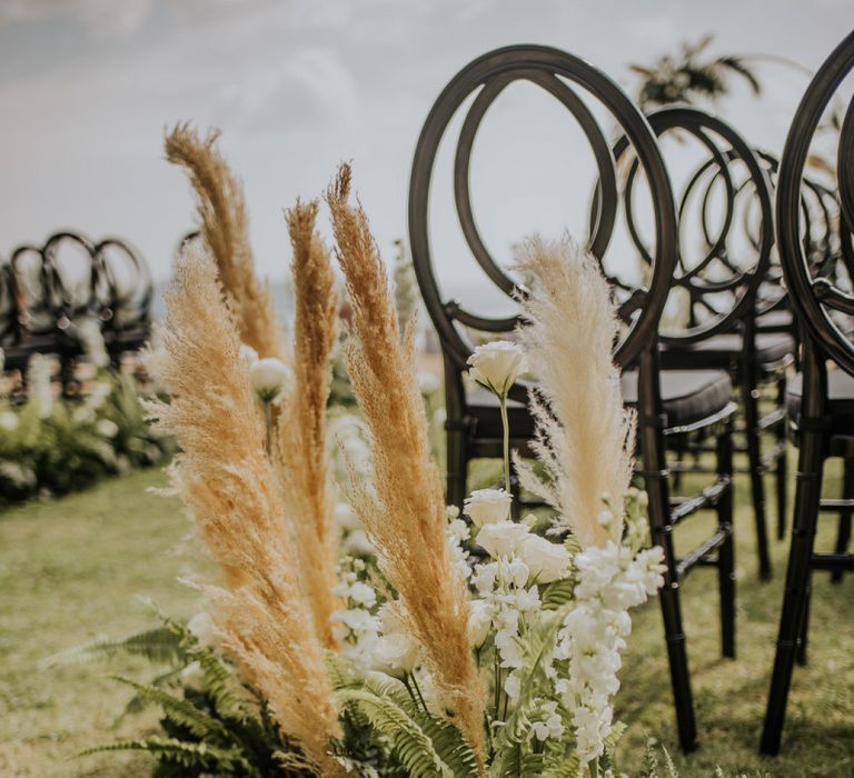 Pampas grass wedding decor at outdoor ceremony