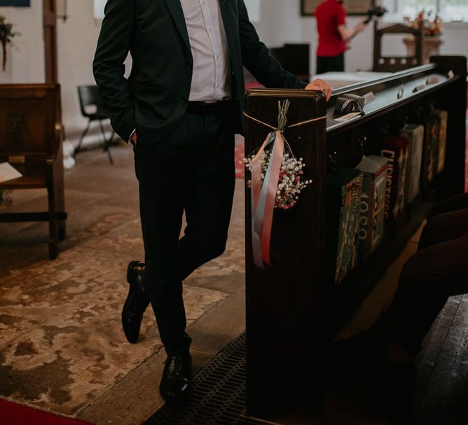 Groom at the Altar in Black Suit and Bow Tie