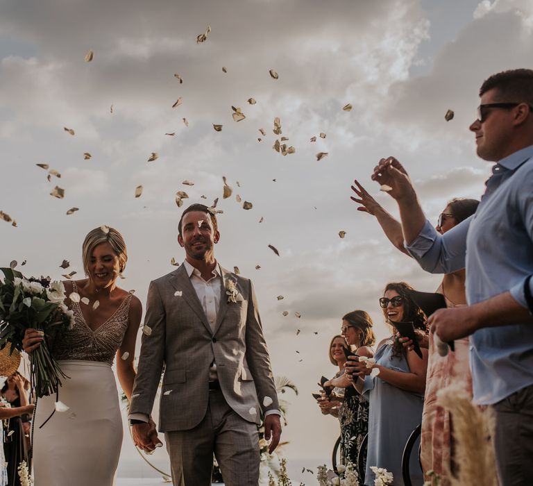 Confetti exit for bride and groom at intimate Thailand wedding