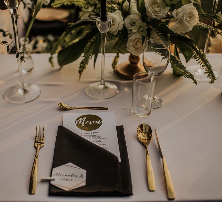 Gold wedding place setting with gold detail menu