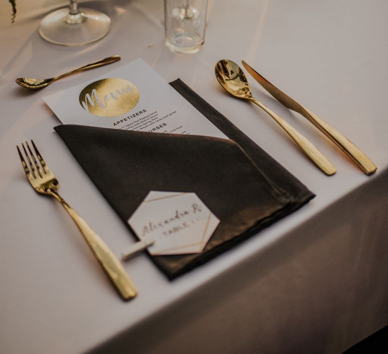 Gold wedding place setting with gold detail menu