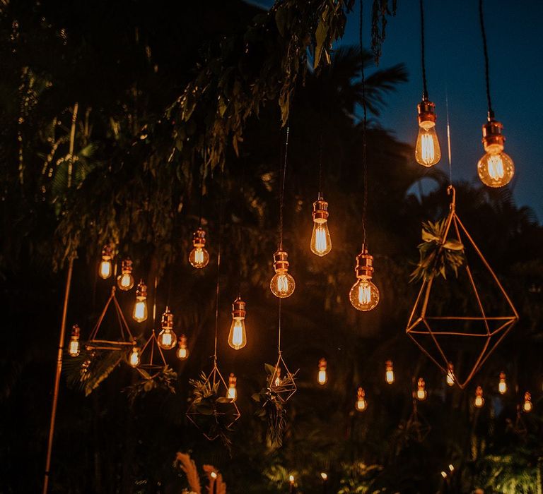 Hanging light installation at intimate destination Thailand wedding