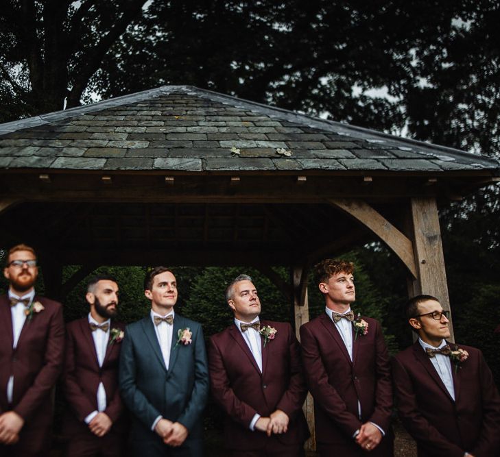 Groomsmen in Navy and Burgundy Suits and Bow Ties