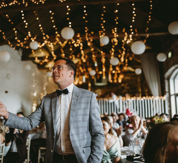 Wedding Guest in Check Blazer and Bow Tie at Askham Hall Wedding