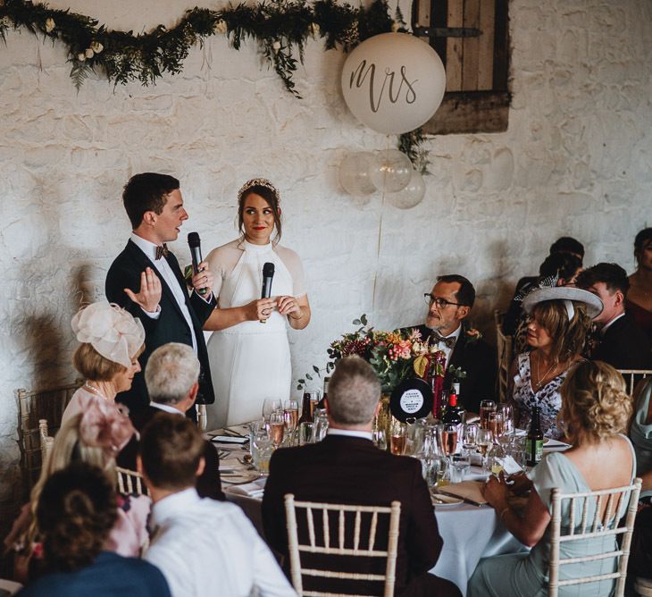 Bride and Groom Delivering the Wedding Speech Together