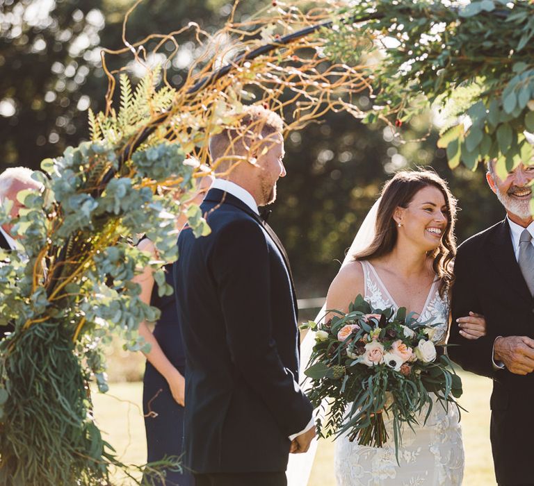 Bride and groom tie the knot at Crouchers Orchards for sophisticated outdoor ceremony