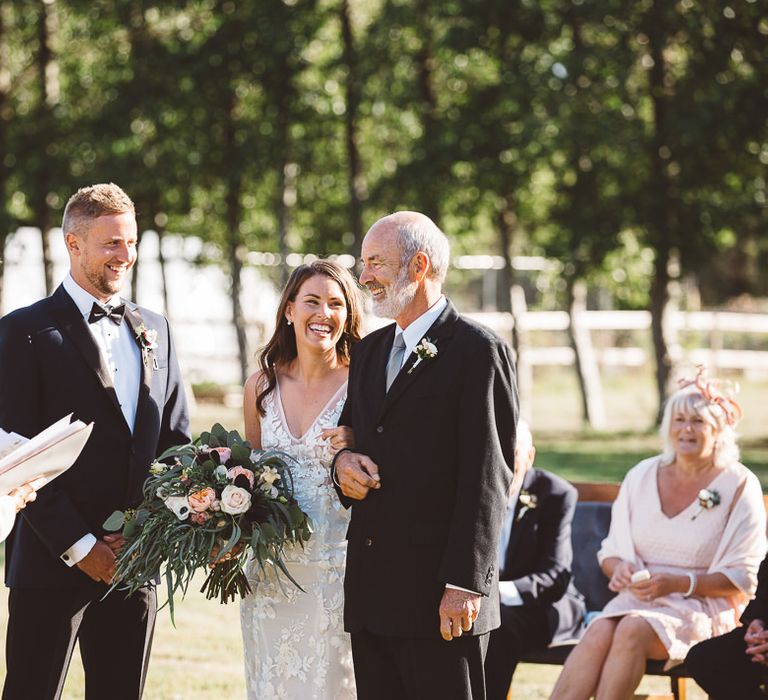 Bride wearing beautiful Made With Love Bridal dress at intimate ceremony with seven guests