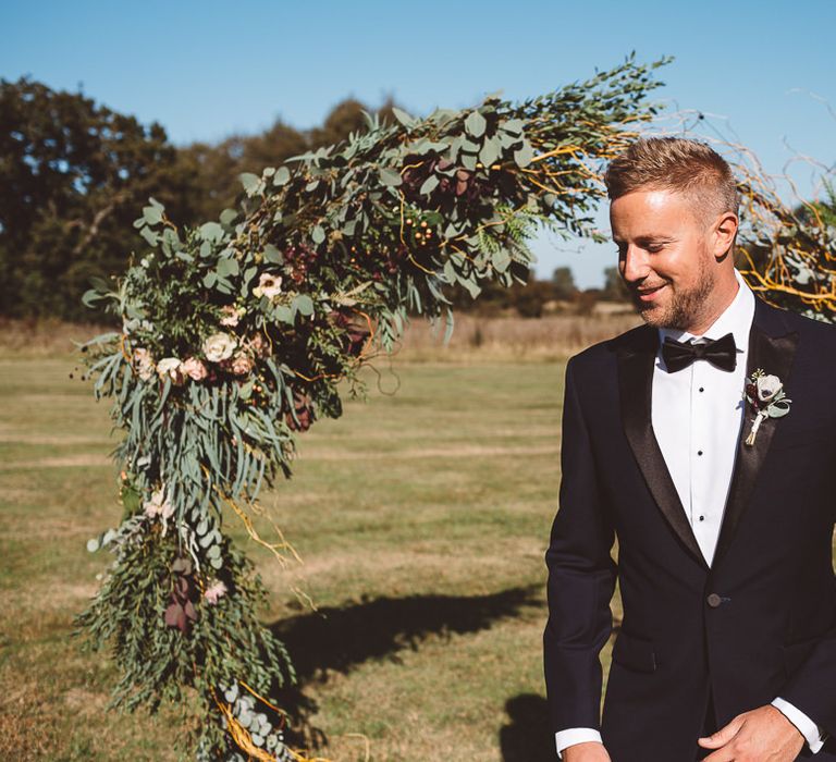 Aisle hoop decor styled with eucalyptus and foliage at Crouchers Orchards for outdoor ceremony