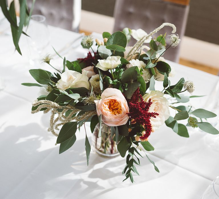 Beautiful floral table arrangements for intimate dinner reception