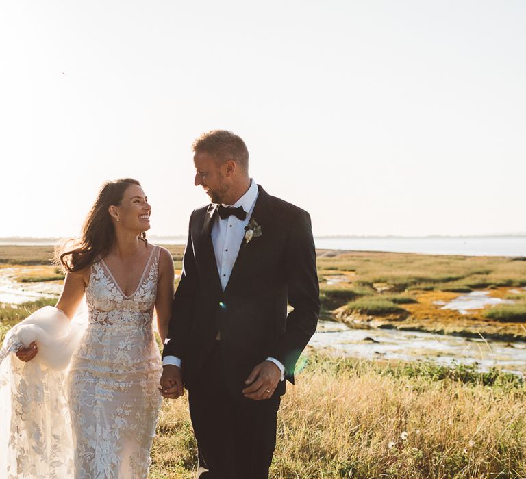 Bride and groom steal a moment together and enjoy golden hour