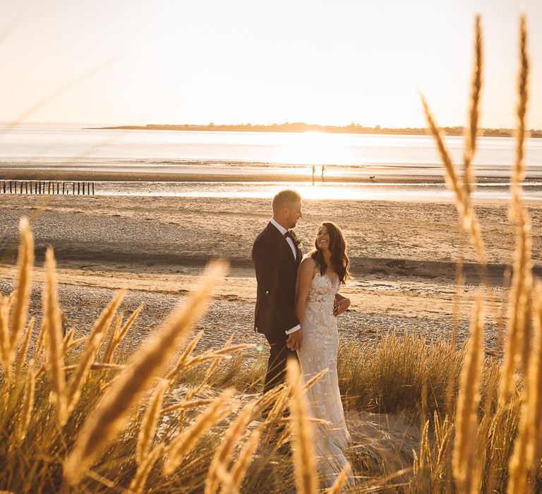 Couple embrace at Crouchers Orchards for romantic and intimate wedding