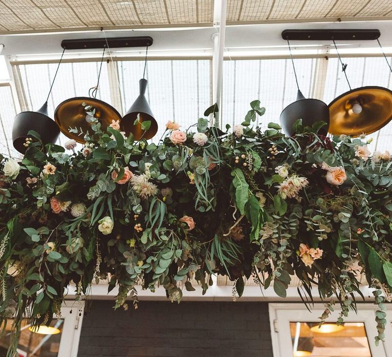 Beautiful hanging foliage styled with eucalyptus for a romantic and intimate dinner at Crouchers Orchards