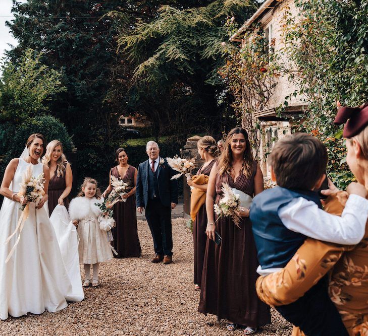 Bridal party arrive at Cripps Barn for October wedding