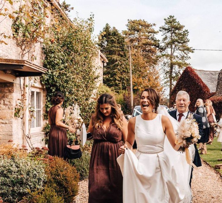 Bridal party with brown bridesmaid dresses for October wedding