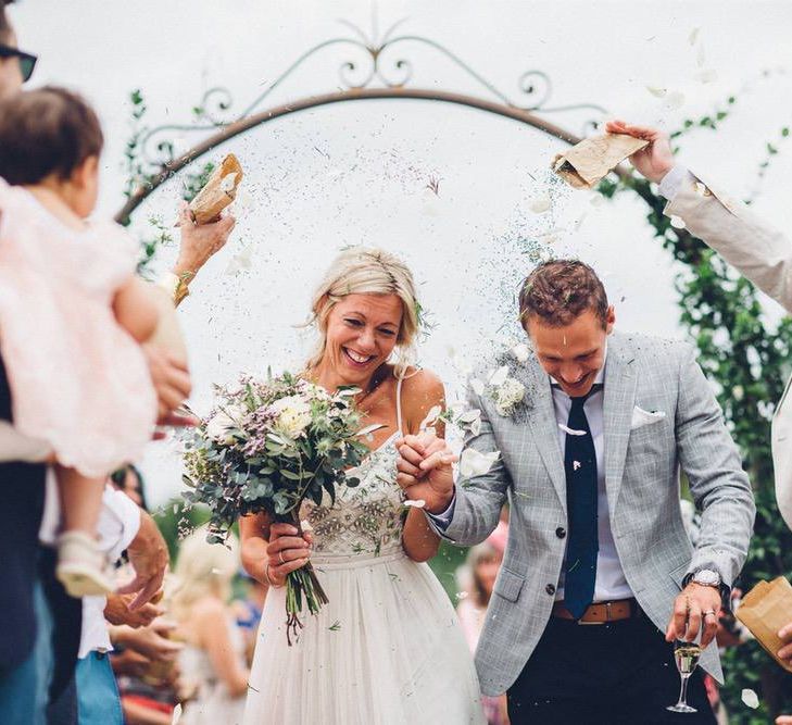 Confetti Exit | Bride in Needle &amp; Thread Gown | Groom in Reiss Chinos &amp; Blazer | Outdoor Destination Wedding at Le Peit Hameau Wedding Venue Provence, South of France Planned by By Mademoiselle | Lovestruck Photography