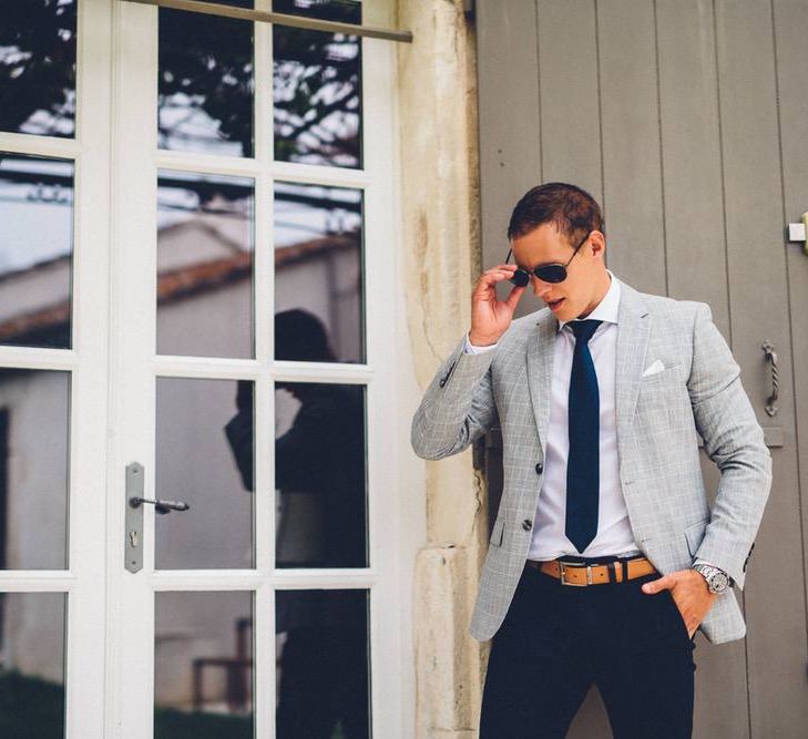 Groom in Reiss Navy Chinos &amp; Grey Check Blazer | Outdoor Destination Wedding at Le Peit Hameau Wedding Venue Provence, South of France Planned by By Mademoiselle | Lovestruck Photography