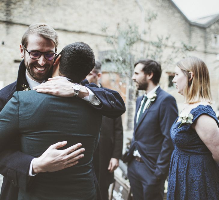 Groom Greeting Guests