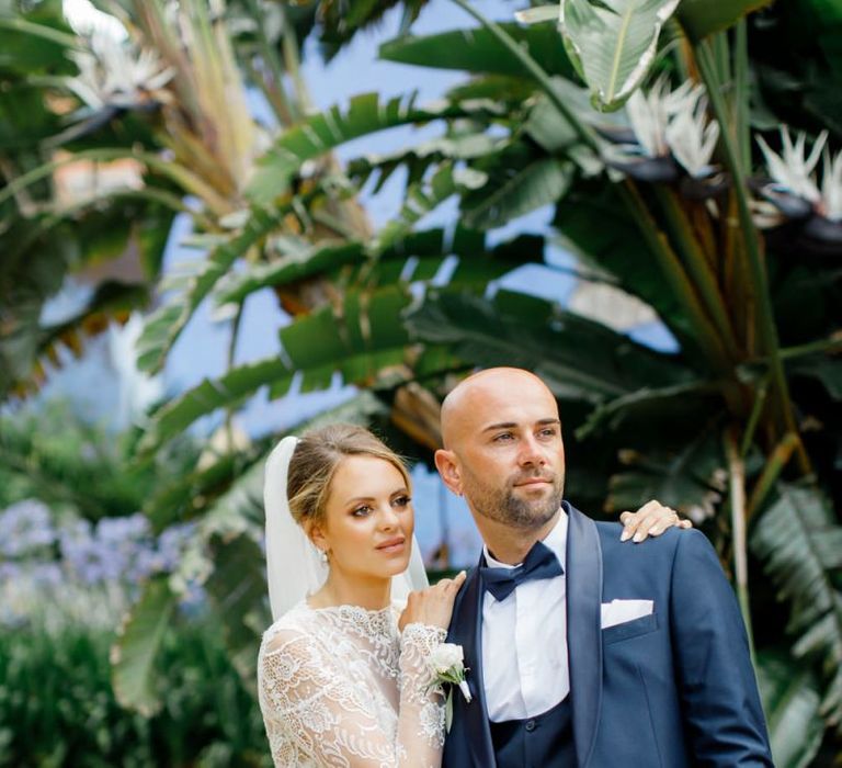 Elegant Bride and Groom in Lace Dress and Navy Suit