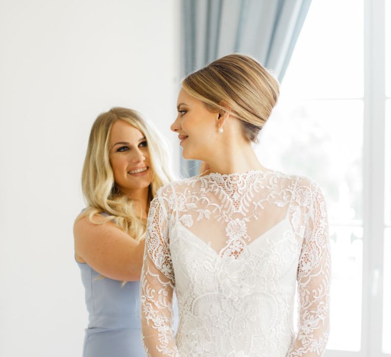 Bride Getting Ready in Lace Long Sleeve Wedding Dress