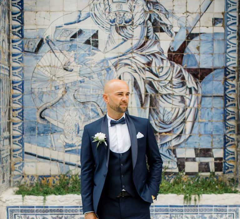 Groom in Navy Tuxedo with Horseshoe Waistcoat