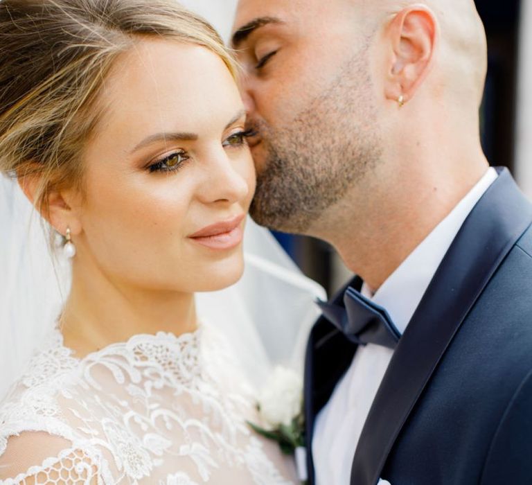 Bride in Lace High Neck Wedding Dress with Natural Bridal Makeup and Chic Updo