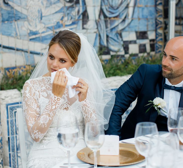 Emotional Bride in Lace Wedding Dress at the Reception Speeches