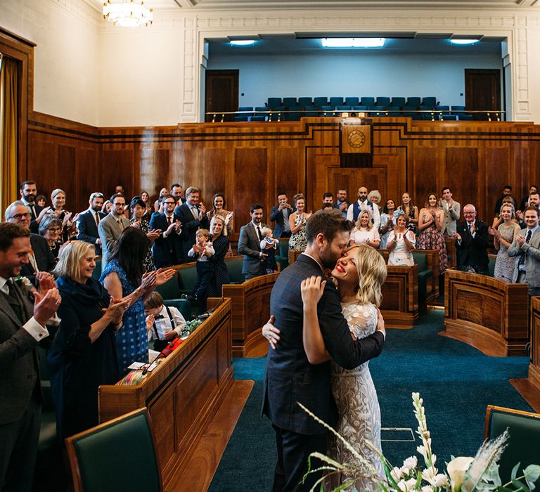 Hackney Town Hall Wedding Ceremony with Bride in Lace Hermione De Paula Wedding Dress and Groom in Ted Baker Suit