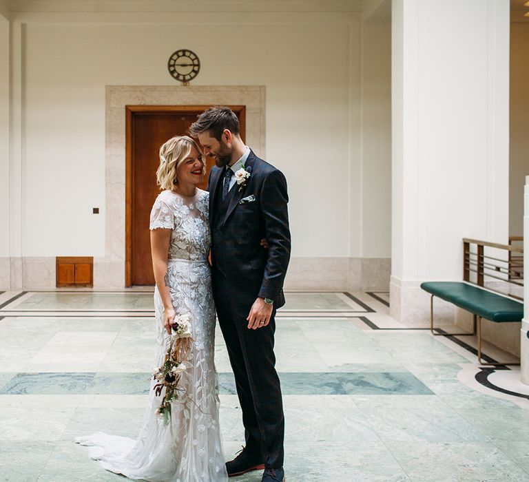 Bride in Lace Hermione De Paula Wedding Dress and Groom in Ted Baker Suit at Hackney Town Hall