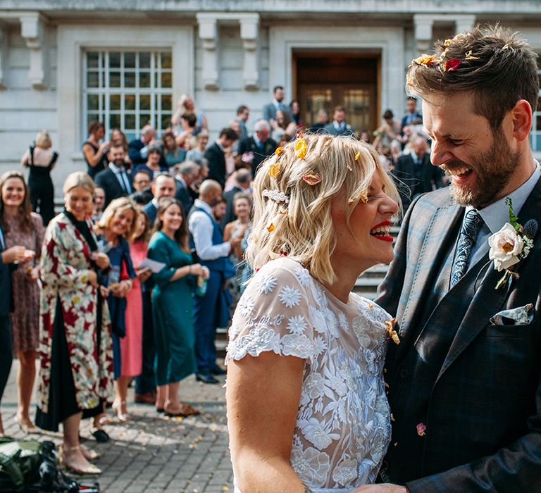 Confetti Moment with Bride in Lace Hermione De Paula Wedding Dress and Groom in Ted Baker Suit